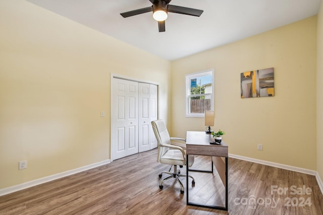 home office with wood-type flooring and ceiling fan