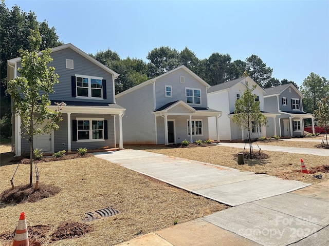 view of front property with a garage and covered porch