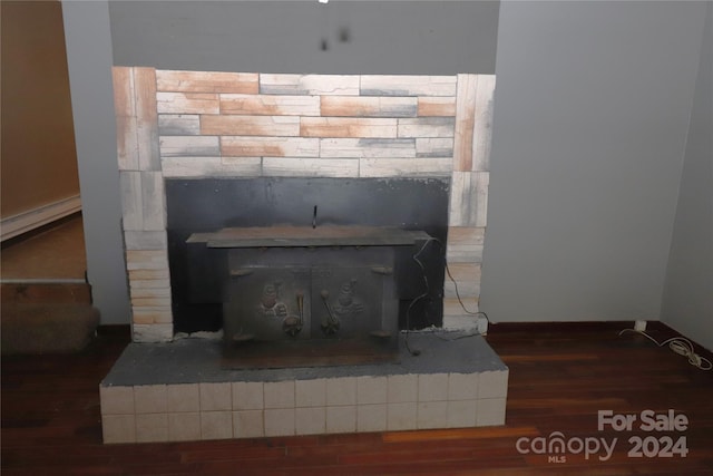 details with wood-type flooring and a baseboard radiator