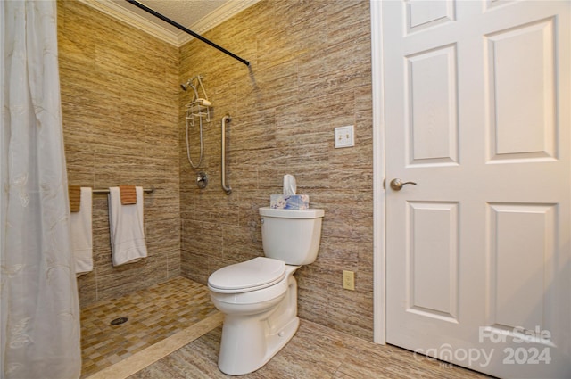 bathroom featuring tile walls, ornamental molding, toilet, and a shower with curtain