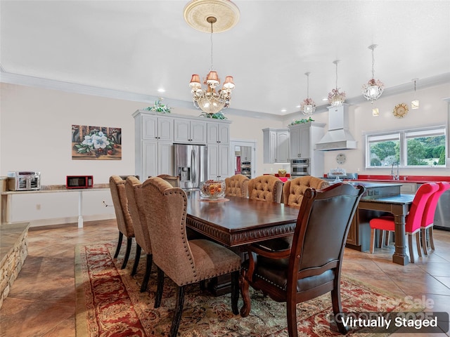 dining room with sink, a notable chandelier, and ornamental molding