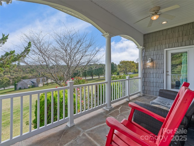 balcony with ceiling fan and covered porch