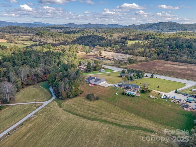 drone / aerial view with a mountain view and a rural view