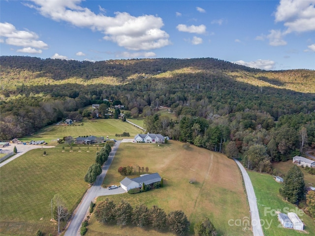 birds eye view of property with a rural view