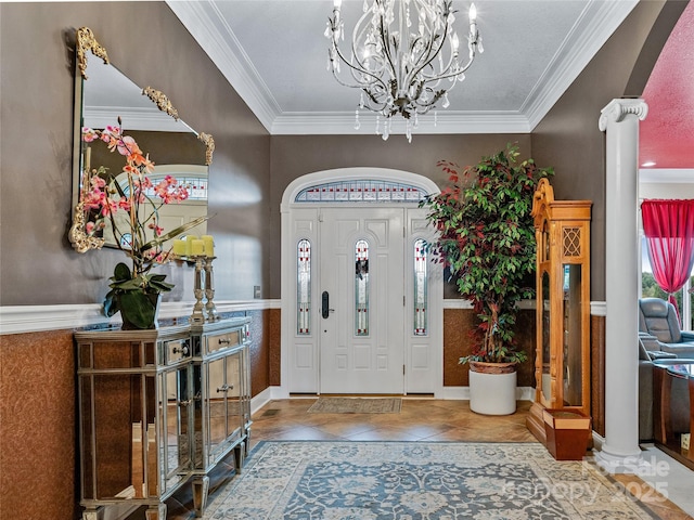 tiled foyer entrance featuring arched walkways, crown molding, and an inviting chandelier