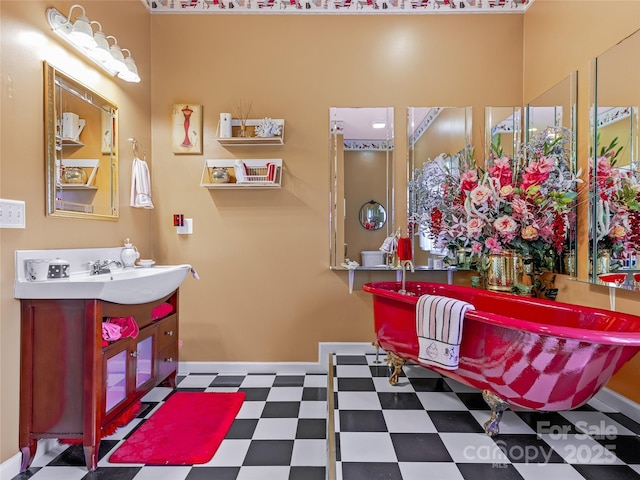 full bathroom with vanity, baseboards, and tile patterned floors