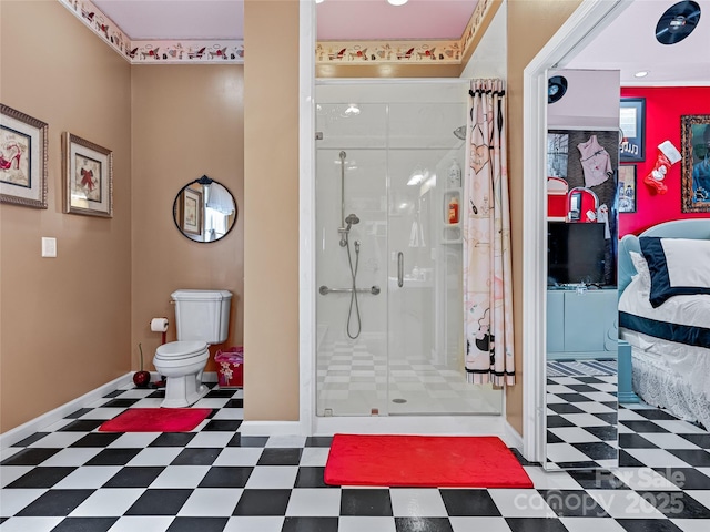 full bath with toilet, a shower stall, baseboards, and tile patterned floors