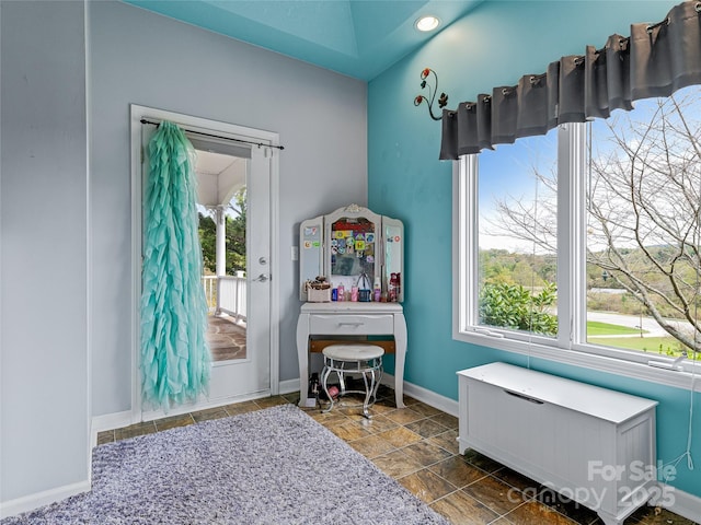 recreation room with a wealth of natural light and baseboards