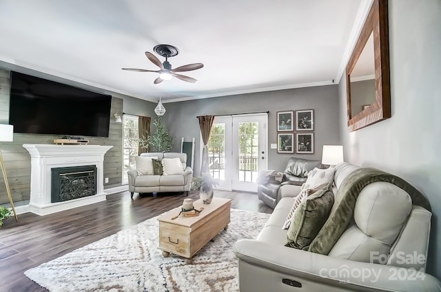 living room featuring ceiling fan, hardwood / wood-style flooring, and crown molding