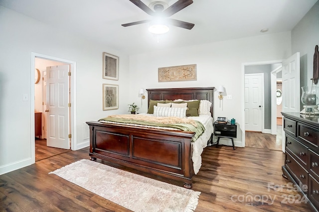 bedroom with ceiling fan and dark hardwood / wood-style floors