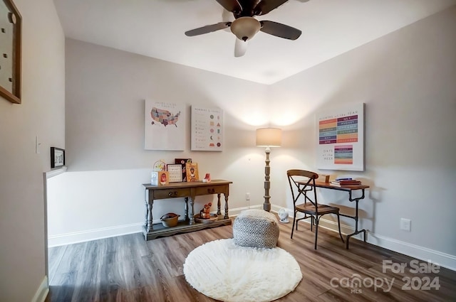 sitting room featuring ceiling fan and hardwood / wood-style floors