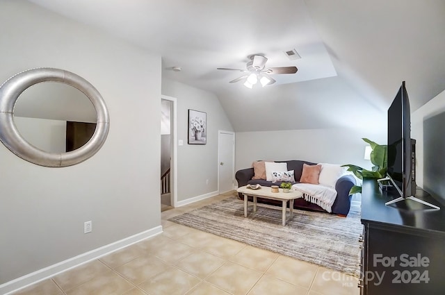 living area featuring ceiling fan and vaulted ceiling