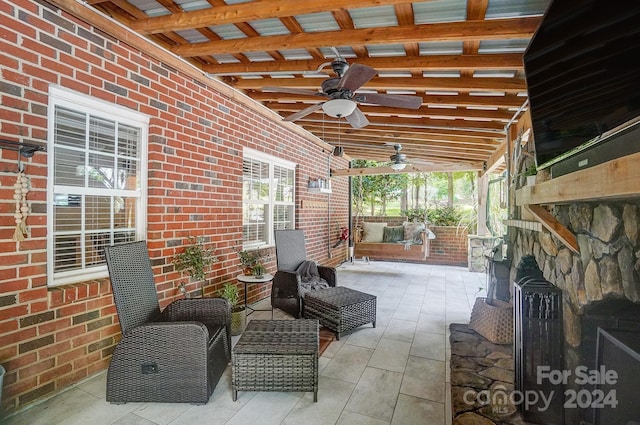 view of patio / terrace featuring ceiling fan