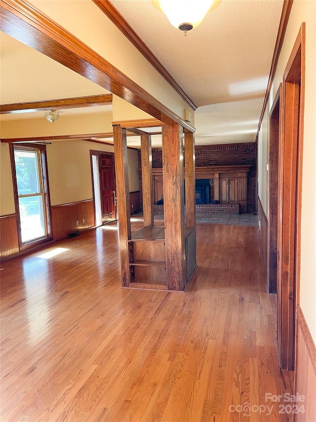 1610 Sierra Rd, York, SC 29745 - interior space with a wainscoted wall, wood finished floors, a textured ceiling, and crown molding