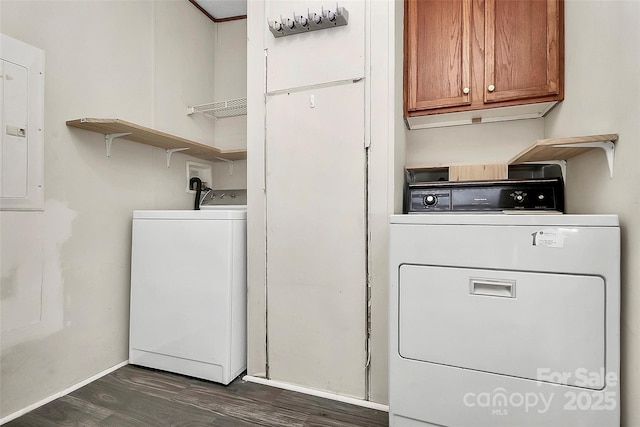 laundry area with washer and clothes dryer, dark hardwood / wood-style floors, cabinets, and electric panel