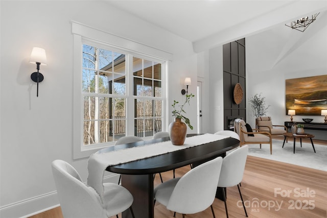 dining space with light wood-type flooring