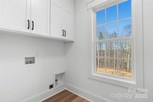 laundry room with cabinets, washer hookup, hardwood / wood-style floors, and electric dryer hookup