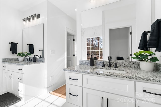 bathroom featuring vanity and hardwood / wood-style flooring