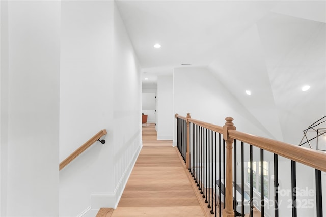 hall with light hardwood / wood-style flooring