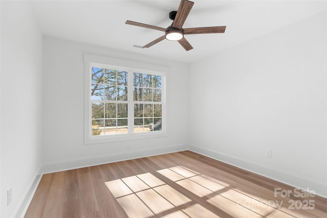 unfurnished room with ceiling fan and light hardwood / wood-style floors