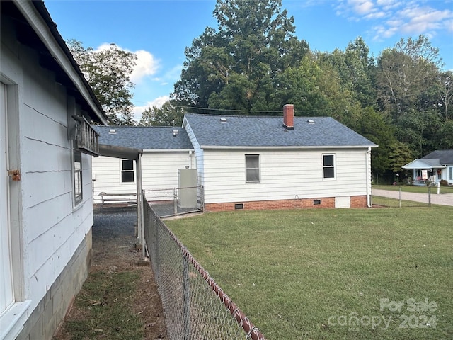 rear view of property with a yard