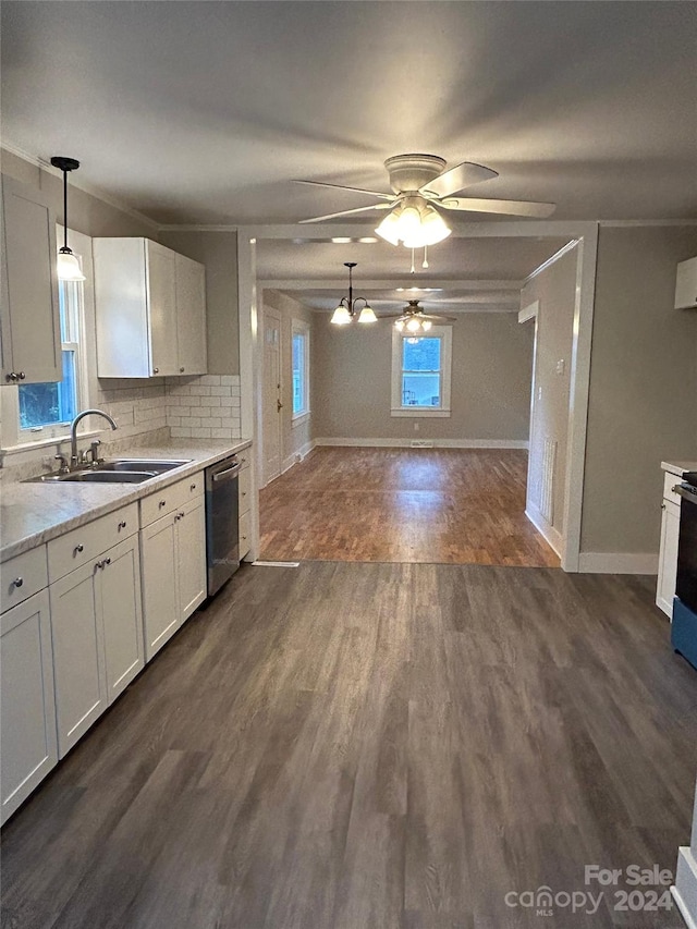 kitchen featuring hanging light fixtures, stainless steel dishwasher, dark wood-type flooring, and ceiling fan