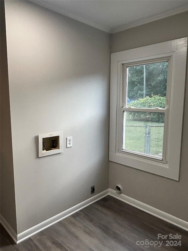 washroom with hookup for a washing machine, ornamental molding, and dark hardwood / wood-style flooring