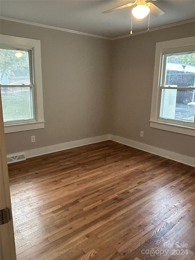 spare room featuring ceiling fan, crown molding, and dark hardwood / wood-style flooring