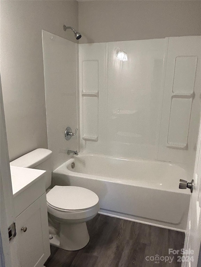 full bathroom featuring shower / bathing tub combination, vanity, toilet, and hardwood / wood-style flooring