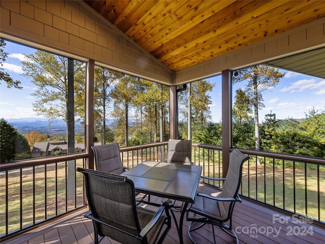 sunroom featuring wooden ceiling and lofted ceiling