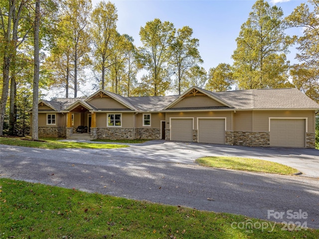 ranch-style home featuring a garage