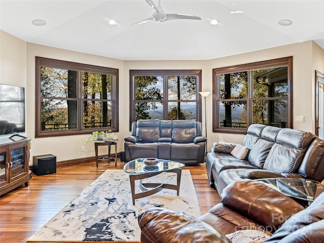 living room featuring ceiling fan and light wood-type flooring