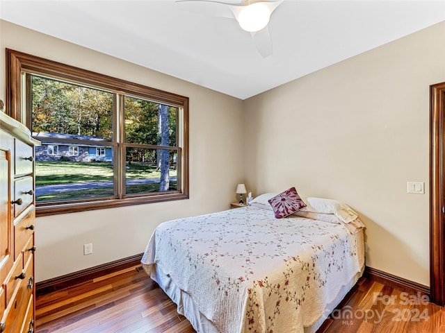 bedroom featuring ceiling fan and hardwood / wood-style flooring