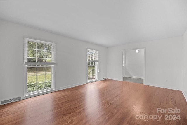 empty room featuring hardwood / wood-style flooring