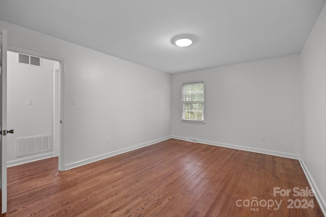 empty room featuring hardwood / wood-style flooring