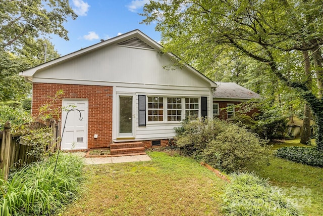 view of front of home with a front yard