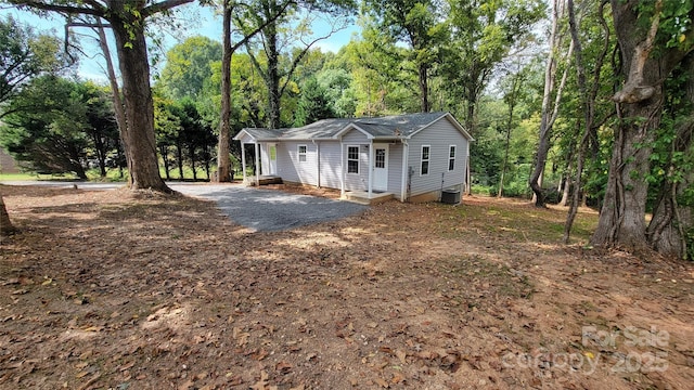 ranch-style house with central AC unit