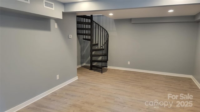 basement featuring light hardwood / wood-style flooring