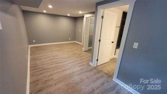 empty room with light hardwood / wood-style floors