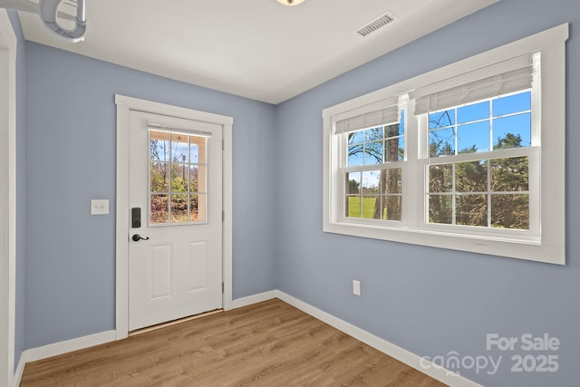 117 Hibriten Mountain Rd SE, Lenoir, NC 28645 - doorway to outside with visible vents, baseboards, and light wood-style floors
