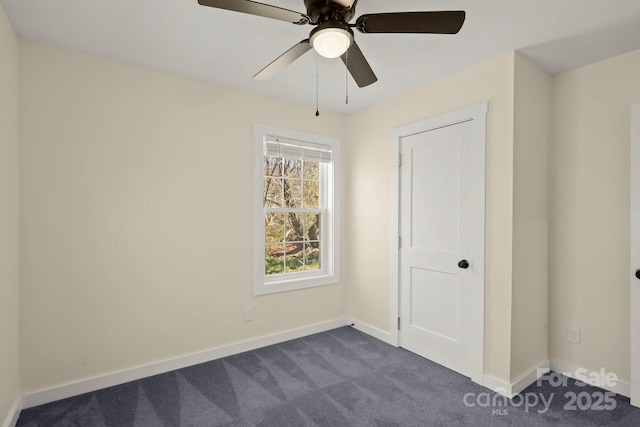 117 Hibriten Mountain Rd SE, Lenoir, NC 28645 - unfurnished bedroom with a ceiling fan, baseboards, and dark colored carpet