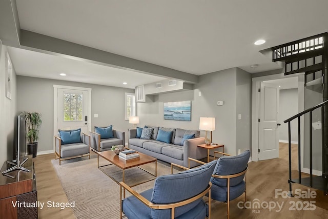 117 Hibriten Mountain Rd SE, Lenoir, NC 28645 - living room with recessed lighting, baseboards, light wood-style flooring, and stairs