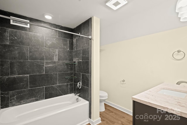 117 Hibriten Mountain Rd SE, Lenoir, NC 28645 - full bath featuring wood finished floors, visible vents, baseboards, shower / bathing tub combination, and toilet