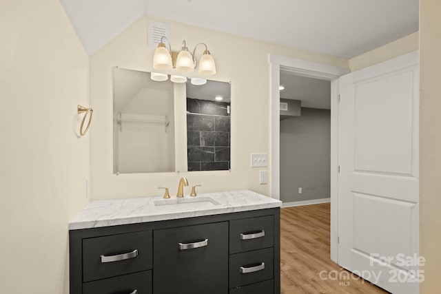 117 Hibriten Mountain Rd SE, Lenoir, NC 28645 - full bath with visible vents, vanity, baseboards, and wood finished floors