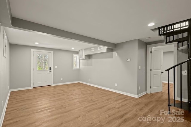 117 Hibriten Mountain Rd SE, Lenoir, NC 28645 - below grade area with visible vents, baseboards, stairs, recessed lighting, and light wood-style floors