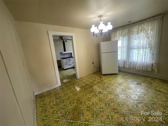 interior space with ceiling fan with notable chandelier