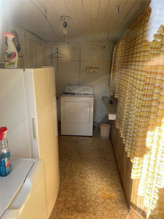 washroom with washer / dryer