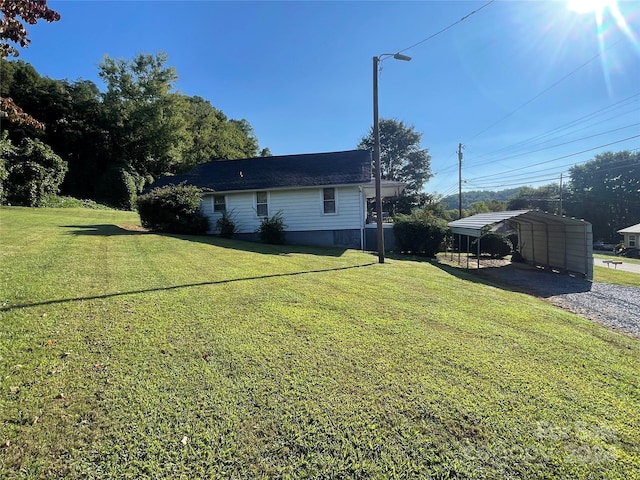 view of yard featuring a carport