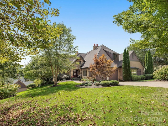 4 Windelsham Way, Arden, NC 28704 - view of front facade with stone siding, decorative driveway, a front yard, and a chimney