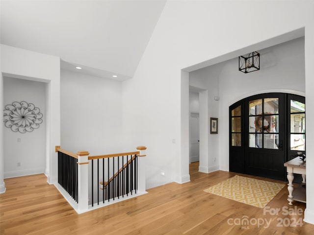 4 Windelsham Way, Arden, NC 28704 - foyer entrance featuring hardwood / wood-style flooring, a high ceiling, and a chandelier
